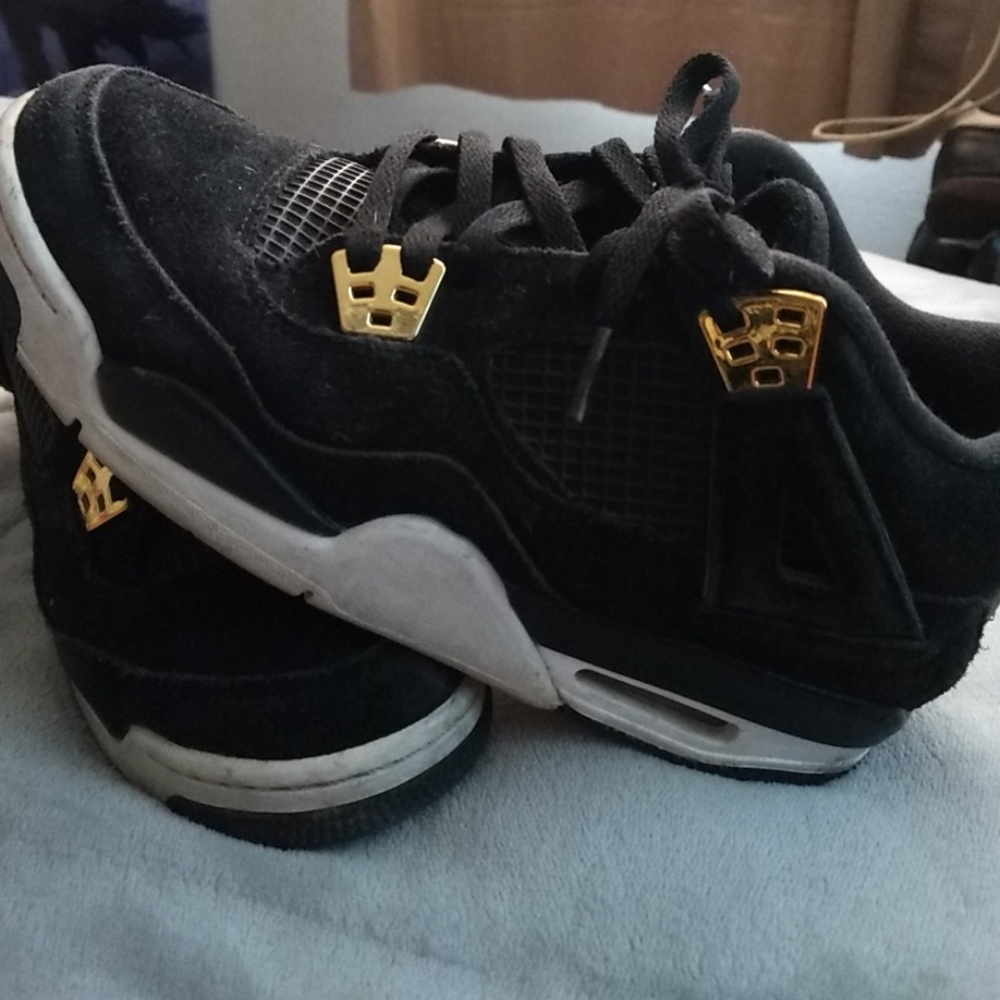 Black and Gold Jordan 4 Retros